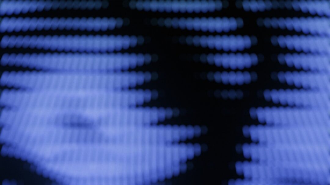 Close-up of a colour grading monitor showing waveform scopes and film footage